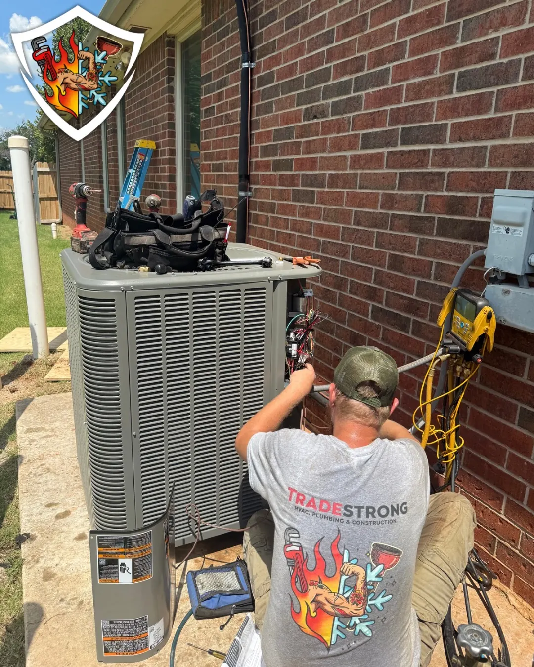 TradeStrong technician installing a replacement air conditioner