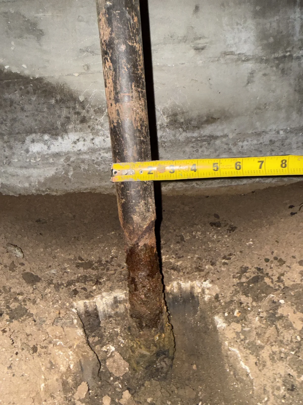 Severely corroded natural gas pipe measured at the crawlspace entry of a Jones Oklahoma property