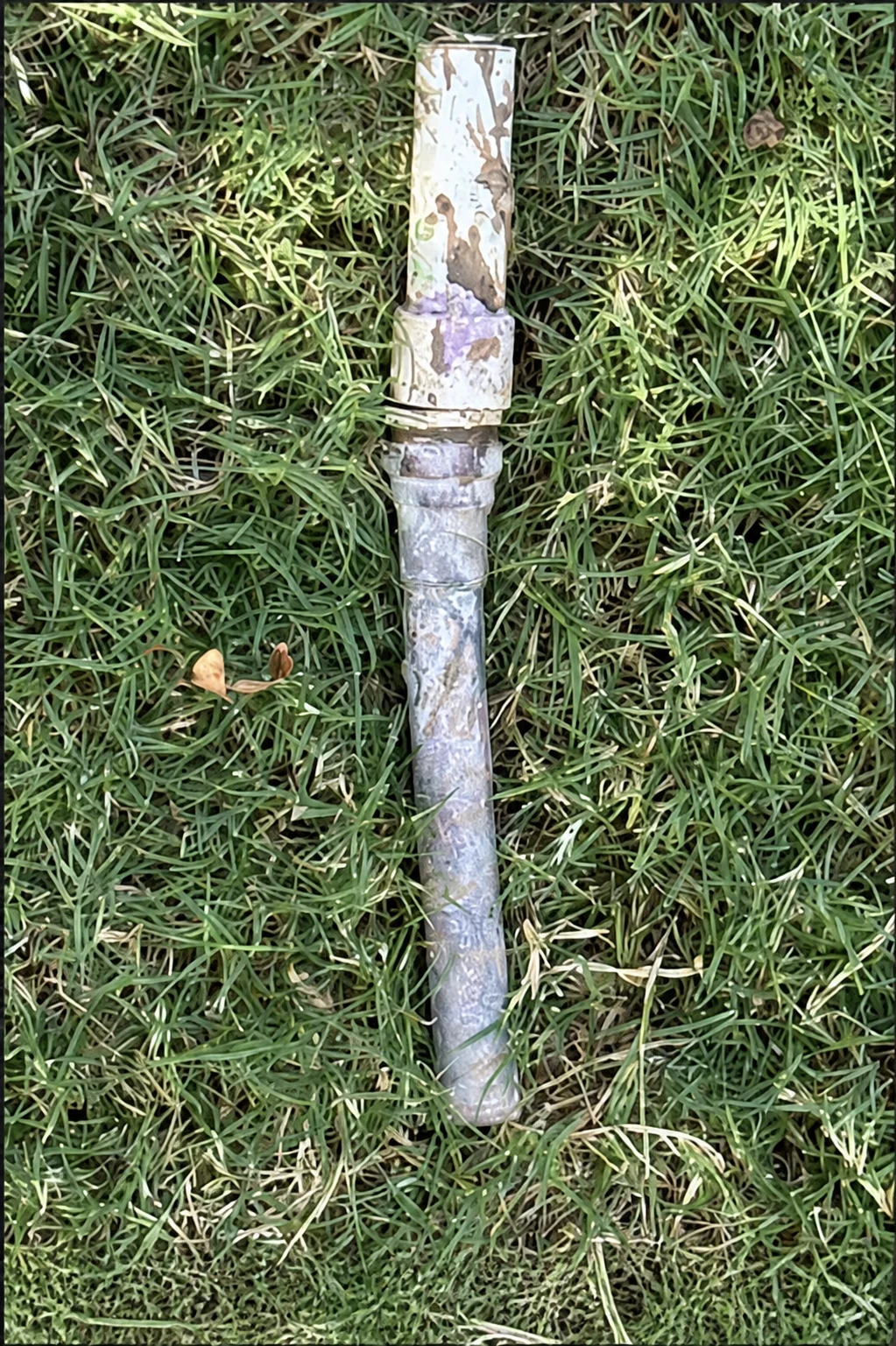 Split PVC male adapter removed from a copper female water-line connection in south Oklahoma City