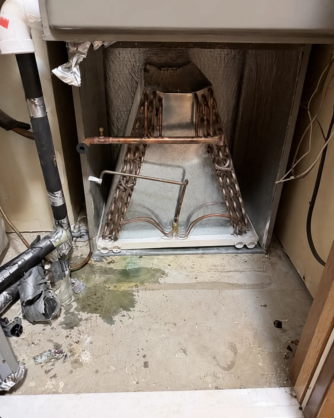Five-ton downflow evaporator coil exposed during replacement in Yukon Oklahoma